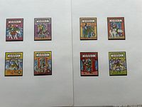 All eight Dominica carousel animal stamps displayed on two album pages