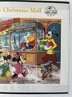 Close-up of right portion with Goofy, Minnie and Mickey stamps