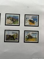 Four Alderney stamps showing 43p, 51p and two others