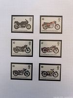 Six Great Britain motorcycle stamps arranged on grid paper