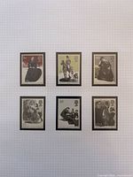 All six stamps laid out on grid background