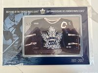 Front view of sealed commemorative patch set on display card