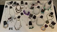 Full layout of all 40 Paparazzi jewelry pieces on white board