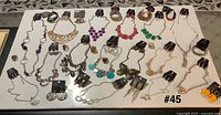 Full layout of all 45 Paparazzi jewelry pieces on tabletop