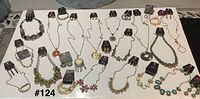 All jewelry laid out on table showing quantity and tags