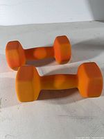 Pair of orange hex dumbbells