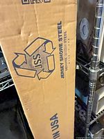 Cardboard box showing Jersey Shore Steel logo and Made in USA text