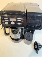 Front view of Hamilton Beach FlexBrew dual coffee maker showing control panel, carafe, and single-serve section