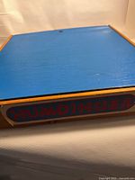 closed box with HUMDINGER label and blue top