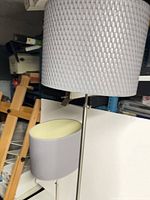 Two matching table lamps showing textured gray shades and metal stems