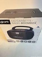 Front of retail box showing GPX CD/Cassette/Radio Boombox