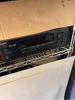 Front view of Onkyo receiver on shelf