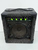 Front view of Quantum 15-watt amplifier showing controls, grille and overall condition