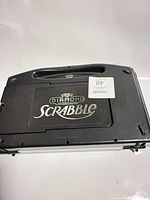 Closed carrying case showing Diamond Scrabble logo