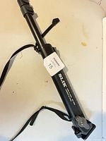 Full view of collapsed Slik monopod with wrist strap