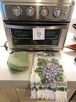 Front view of Cuisinart TOA-60 with accessories