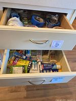 Drawer view showing assorted tapes and adhesives in two drawers