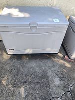 Front view of Lifetime beige plastic outdoor storage container