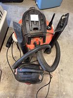 RIDGID large canister vacuum with hose, wands and Craftsman handheld vac on top