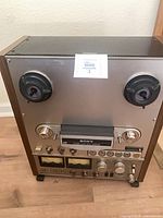 Front view of Sony TC-765 showing reels, controls and meters