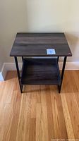 Front view of 2-tier side table showing top, shelf and frame
