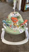 Front view of Fisher-Price stationary jumper showing toys and seat