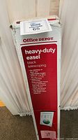 Front of boxed Office Depot heavy-duty black telescoping easel
