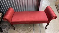 Full view of red patterned chaise lounge bench