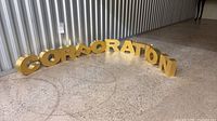 Full set of gold letters arranged on floor