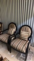 Front view of both striped armchairs with cushions
