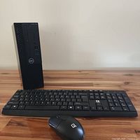 Front and side view of Dell OptiPlex 3060 tower with keyboard and mouse