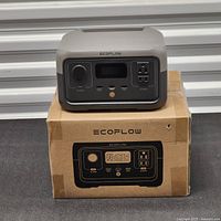 EcoFlow River 2 power station resting on its original box showing front panel and ports