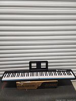 Keyboard fully unfolded with music rest attached