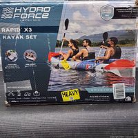 Retail box showing Hydro Force Rapid X3 inflatable 3-person kayak and included contents