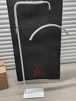 Full view of assembled white floor lamp with curved LED bar