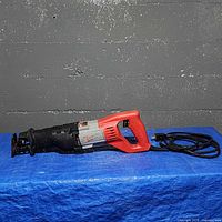 Full view of Milwaukee corded Sawzall reciprocating saw showing handle, motor housing, front shoe and attached power cord