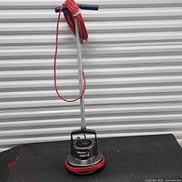 Full view of Oreck XL Orbiter floor machine standing upright