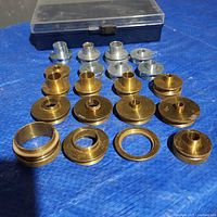 All bushings and storage case displayed on surface