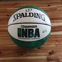 Front view showing Spalding logo, NBA Commander branding, green and white panels
