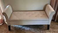 Front view of upholstered storage bench closed