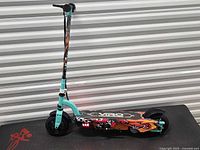 Full view of Viro kids electric scooter showing colour scheme, deck graphics, wheels and lighting