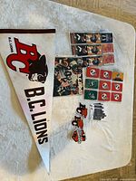 Full lot overview on table including pennant, schedules, coasters, magazine, decals