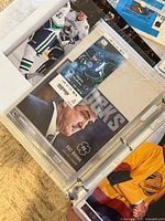 Binder sleeve with Pat Quinn Canucks print and game ticket stub