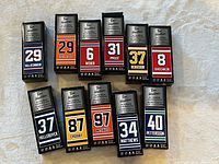 All eleven boxed Tim Hortons NHL mini sticks displayed in two rows