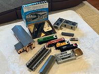 Entire lot laid out: locomotives, buildings, bridge, boxed pier set, track