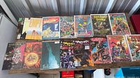 Tabletop view of 14 assorted comic books