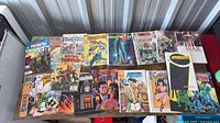 Full lot overview; two rows of comics on table