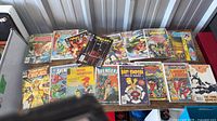 Overview of entire group of comic books on table