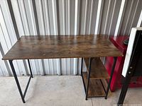 Full view of the computer desk showing top, frame and shelves