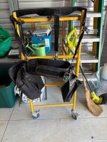 Front view of harness tool belt on stand showing pouches and shoulder straps